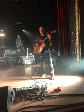 Photo of Derek from Hobo Johnson & the Lovemakers playing acoustic guitar at Royal Oak Music Theatre