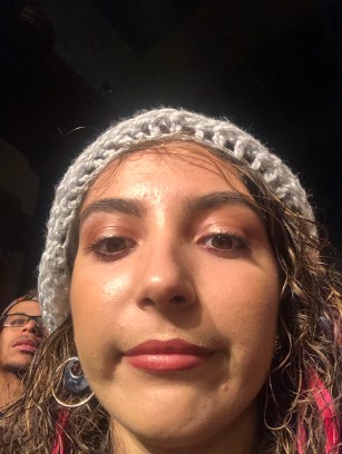 Photo of me at concert wearing gray beanie